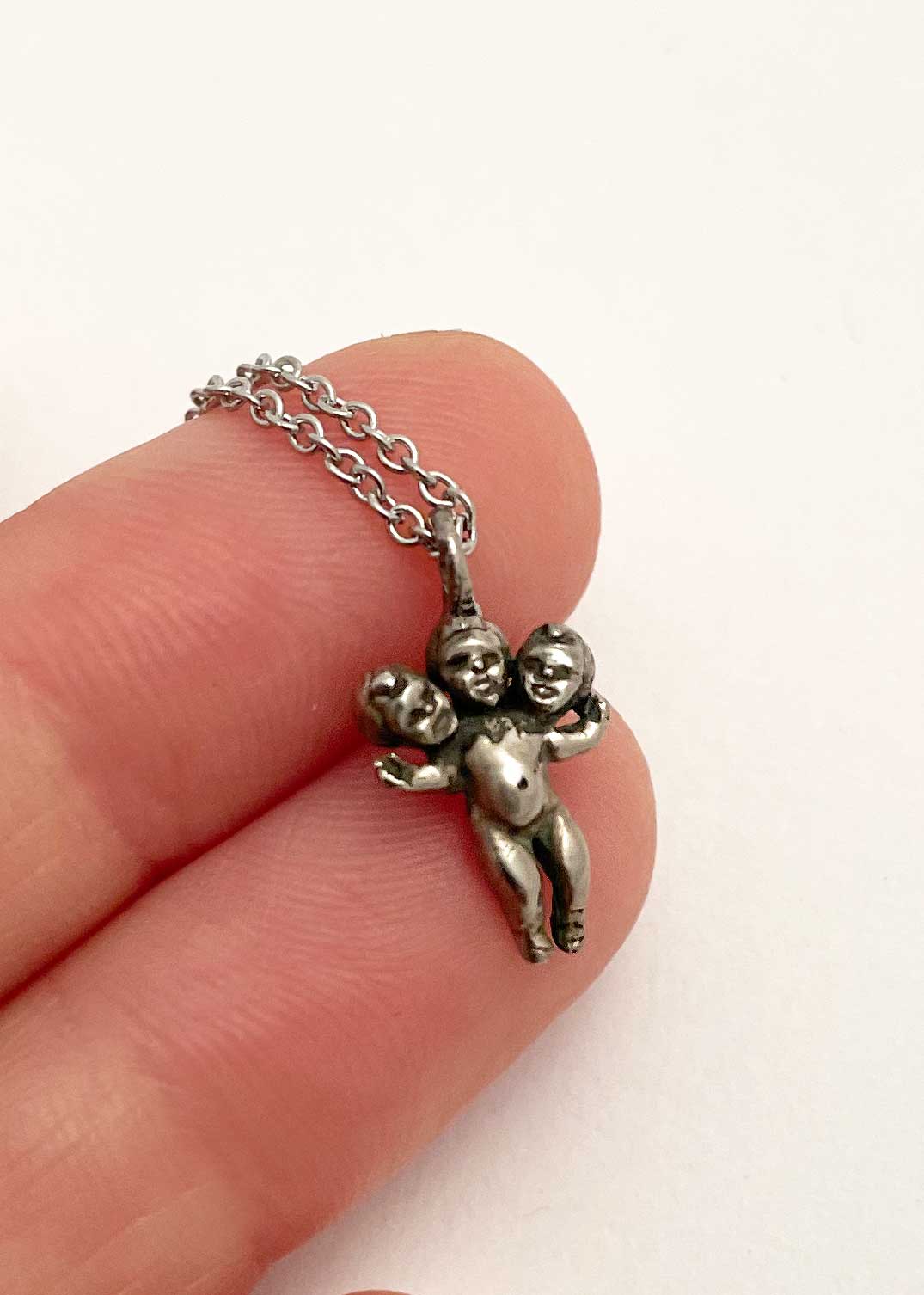 Tiny Three Headed Baby Necklace - Image 3
